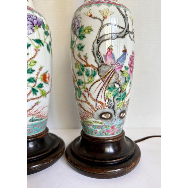 Here is a charming pair of vintage Chinese porcelain table lamps, likely dating to the mid-late 20th century, featuring a...