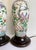 Here is a charming pair of vintage Chinese porcelain table lamps, likely dating to the mid-late 20th century, featuring a...