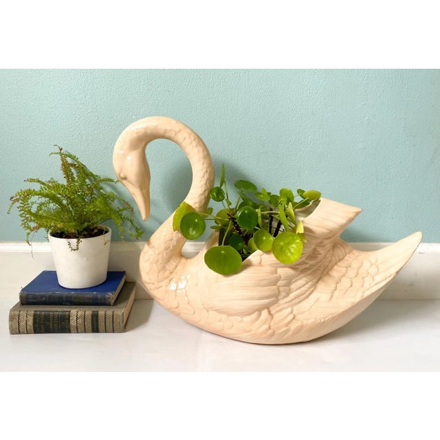 Captivating and whimsical peach-colored swan. Mid to late 20th century glazed ceramic piece, perfect for holding a large...