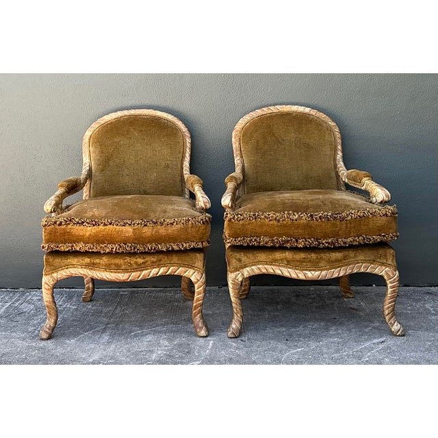 This striking pair of vintage fauteuil chairs offers a masterful blend of French Neoclassical elegance and mid-century...