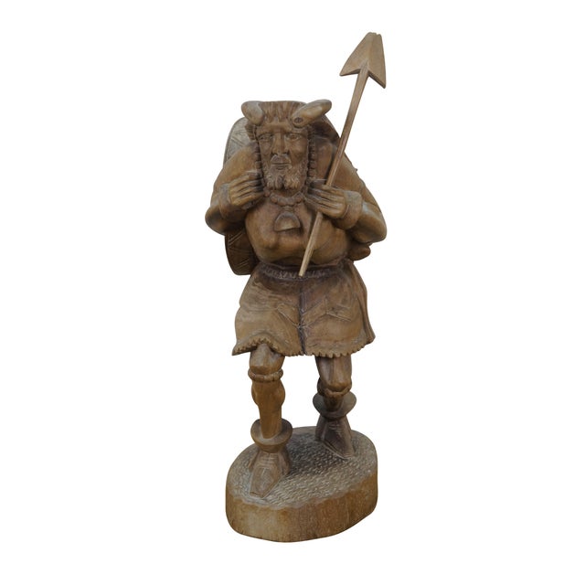Circa mid 20th century rare Ecuadorian folk art, hand carved wood sculpture in the shape of an Incan warrior wearing a...