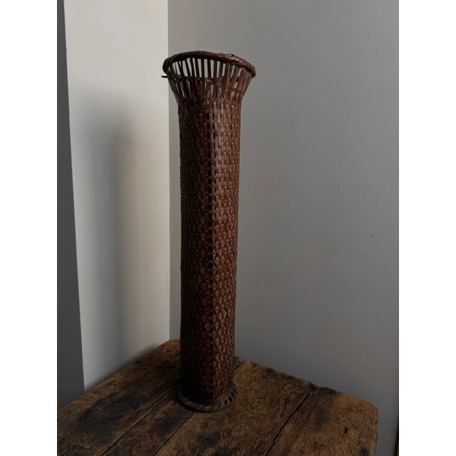 A vase beautifully woven from rattan with a very interesting shape. Cylindrical shape and height makes it perfect for...