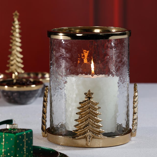 A striking balance of texture, glow, and seasonal charm, this decorative hurricane features a hammered glass cylinder set...