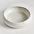 This terracotta low bowl is finished in a shinyWhite reactive glaze with a raw clay base, which is the natural touch that...
