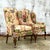 Elevate your space with these vintage boho wingback chairs, beautifully upholstered in Brunschwig & Fils floral fabric....