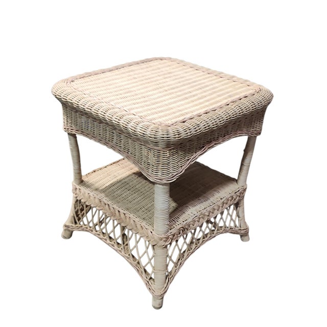 Perfect vintage Continental wicker side table in excellent condition. Solid and balanced construction, center shelf, splay...