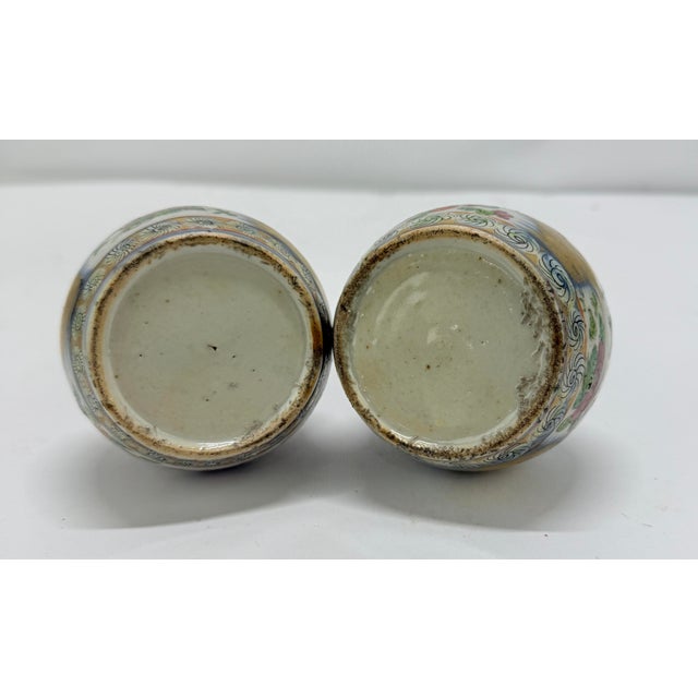 This is a pair of finely enameled Chinese porcelain vases, likely produced in the late Qing Dynasty, circa late 19th...