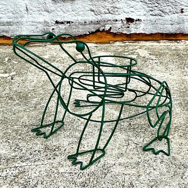 Add a touch of whimsy to your garden or home with this Vintage Boho Wrought Iron Frog Planter. Expertly crafted with...