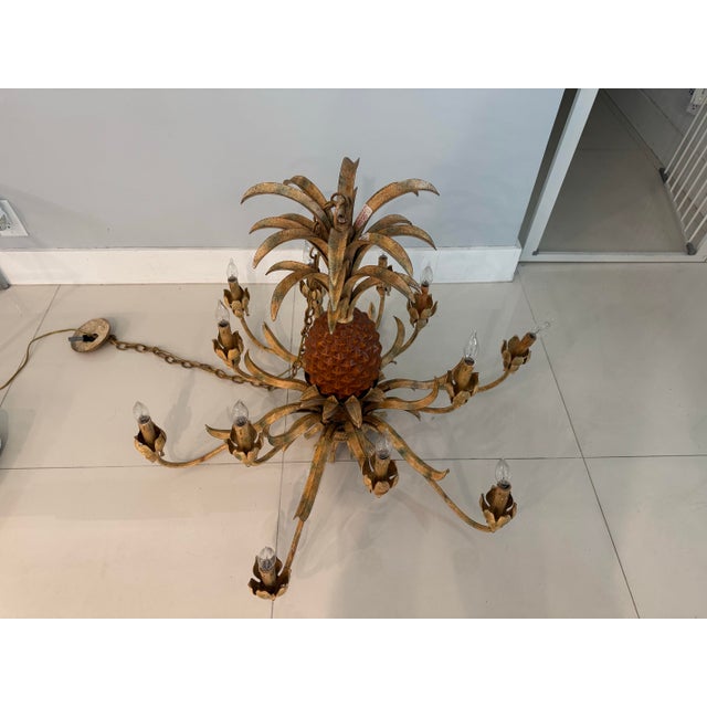 Palm Beach chic with an island-style feel pineapple tole metal chandelier. Twelve lights chandelier that does work with...