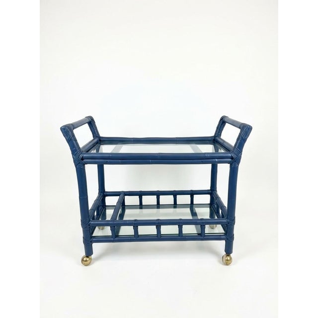 A classic 1970s Hollywood Regency style bar cart expertly constructed from authentic, thick solid-core vintage rattan...