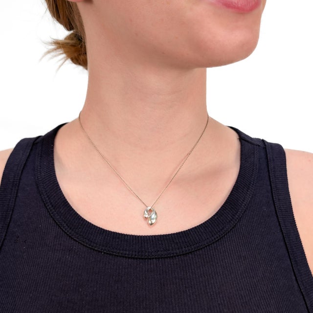 A fine signed vintage silver pendant necklace. By Elsa Peretti for Tiffany & Co. In sterling silver. From the 'Double Tear...