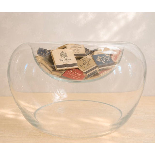 Striking large-scale sculptural art glass centerpiece bowl with an unusual hollow form. The shallow upper bowl appears to...