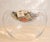 Striking large-scale sculptural art glass centerpiece bowl with an unusual hollow form. The shallow upper bowl appears to...