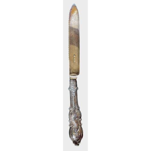 Vintage silver-plated meat carving knife with embossed fruit and acanthus leaf detailing on the blade and acanthus leaf...
