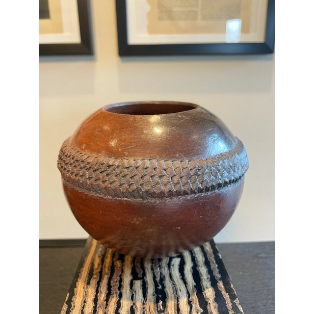 A trio of vessels from the Zulu of South Africa. Burnished clay with beautiful traditional geometric detailing, these are...