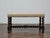 An English barley twist bench from circa 1900, built on a dark oak frame with the deep, tight spirals typical of late...