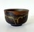 A ceramic tea bowl (chawan) by Japanese American artist Toshiko Takaezu (American, 1922 - 2011) circa 1980s. The hand-...