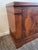 This handsome four-door credenza has a rich, warm wood finish and a strong. Four brass ring pulls set within elongated...