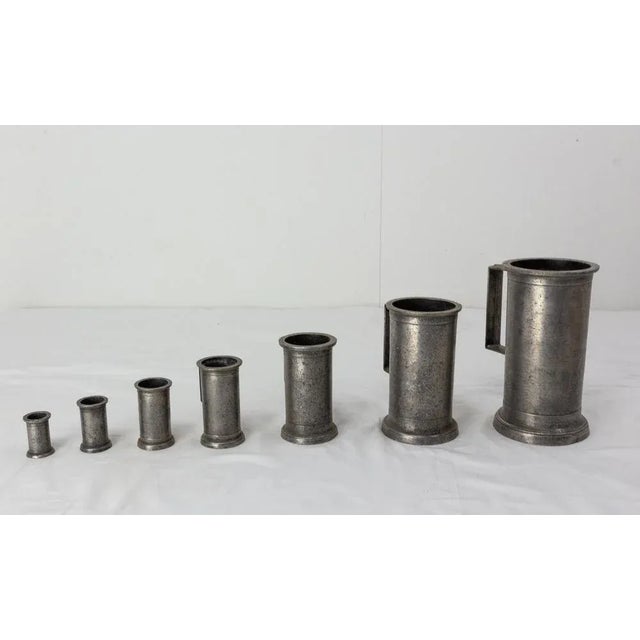 French series of tin timbales. These were used to measure quantities in a business such as a spice shop. Métier equipment...