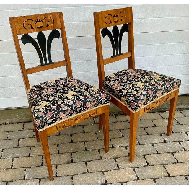 Beautiful clean lined fruitwood antique Biedermeier chairs. Striking ebonized back splat, top rail and front apron inlaid...