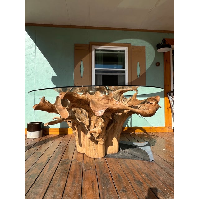This is a museum-quality teak root dining/conference table that makes an instant statement in any indoor or covered...