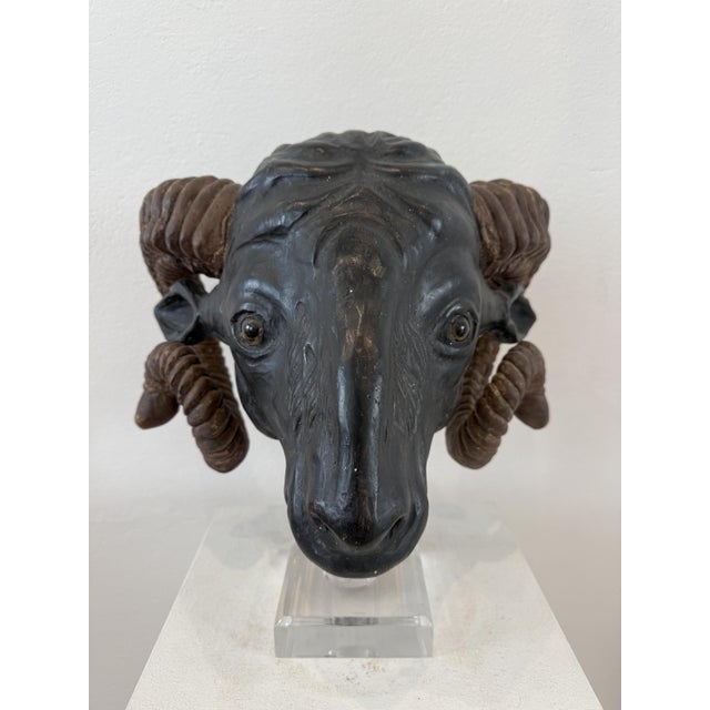 19th-century carved and painted wooden ram's head. Northern Europe. This sculpture depicts the head of a ram with its...