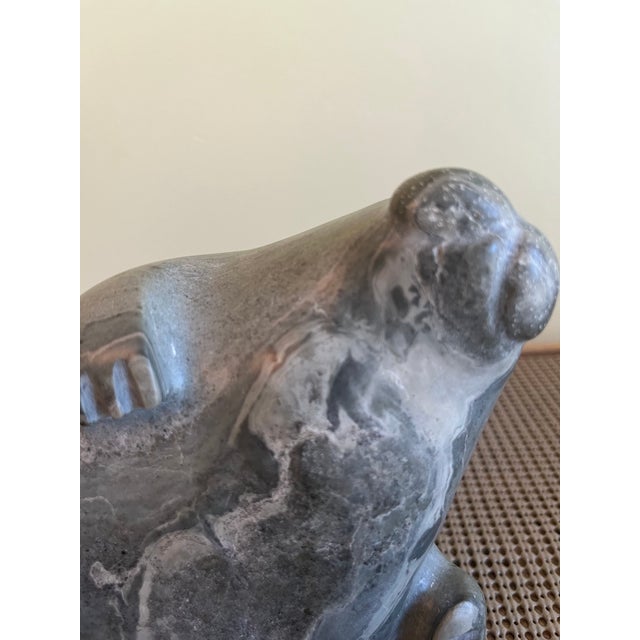This pair of Inuit soapstone carvings were purchased at auction from DuMouchelles Fine Art and Appraisals in Detroit,...