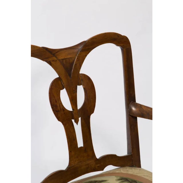 18th century Italian armchair has a beautiful open back with center design back. It is a walnut chair with open-arms and...