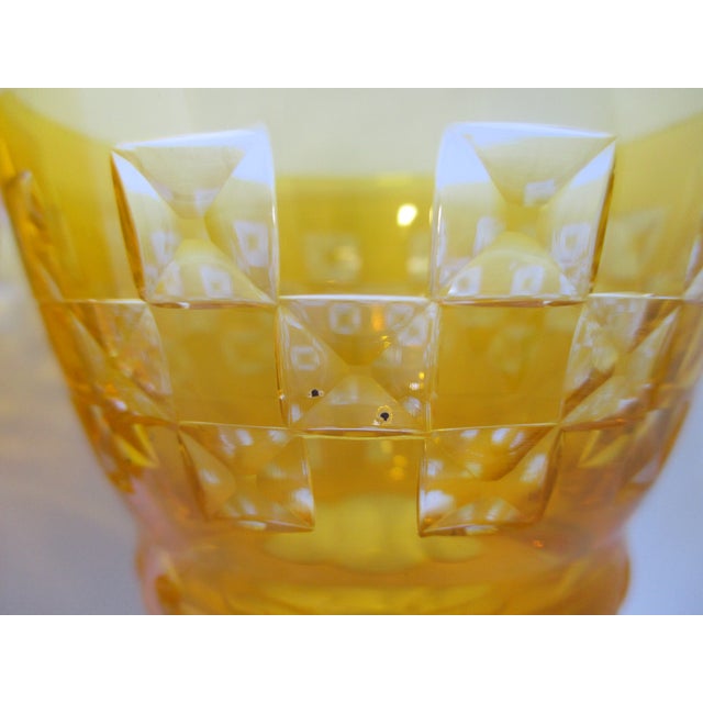 Unusual cut and color all in one pair of wine glasses. Canary yellow cased glass vessel with cut to clear squares that...