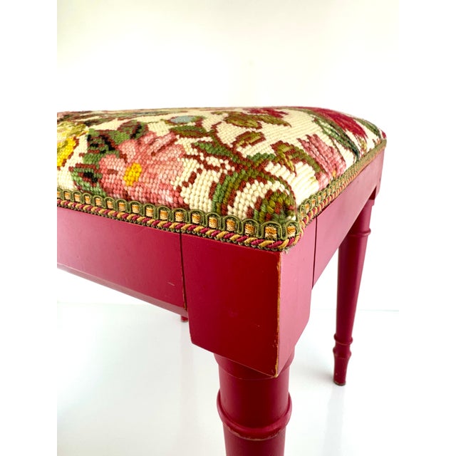This charming vintage stool features a hand-stitched needlepoint seat bursting with bold florals in saturated hues of...