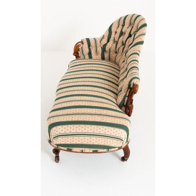 This Pretty Victorian Mahogany Chaise Longue is Raised Upon Shaped and Carved Legs Which Retain Their Original Brass and...