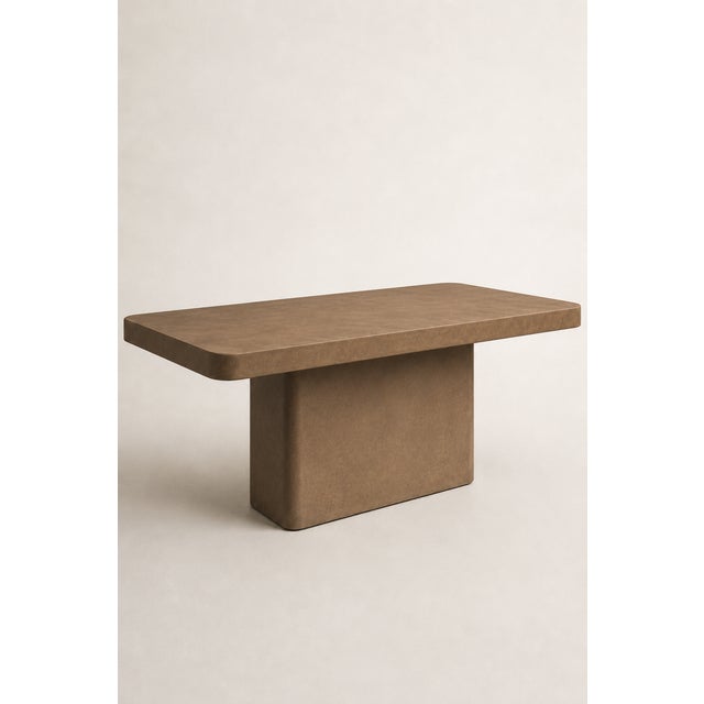 Monolithic rectangular table in bronze-colored microcement, designed by Andrea Toffanin for Hood – Back & Forth Design. A...