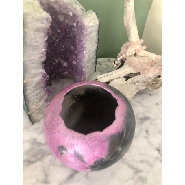 One of a kind studio pottery vessel. Purple and black with a rough organic edged opening and aesthetically pleasing shape...