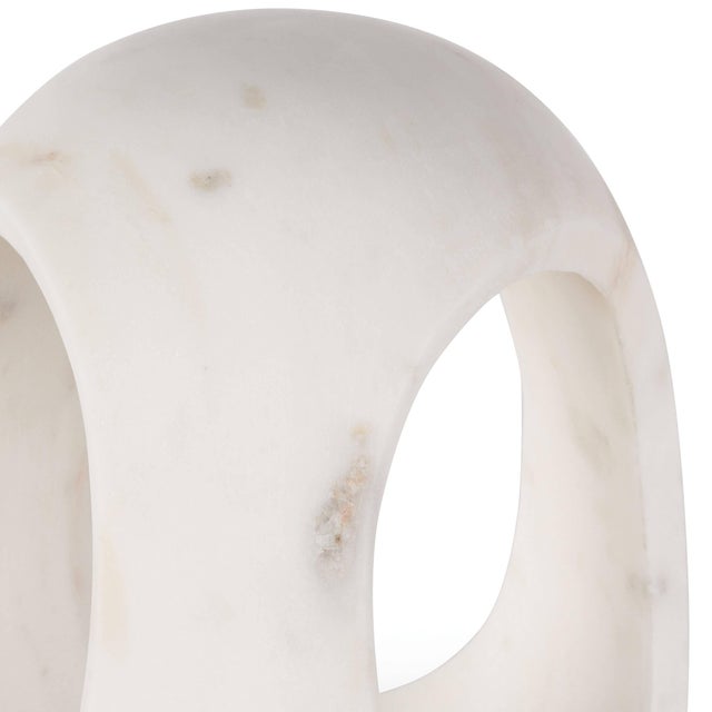 An elegant and sophisticated accessory, this striking white marble sculpture is hand-carved from a single piece of stone....