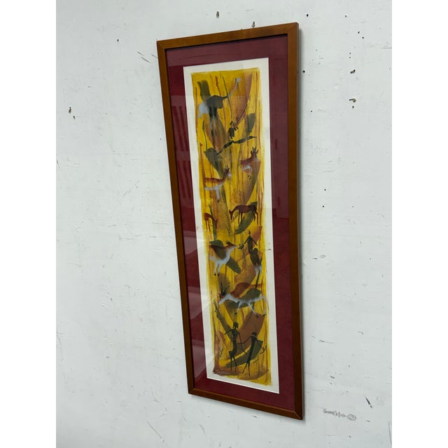Design Plus Gallery presents San Wildlife Painting signed by artist Jahman. This vertical framed artwork depicts a San...