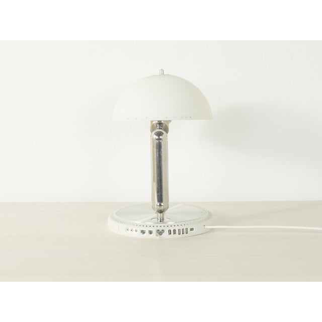 An iconic apple imac g4 from the 2000s, lovingly transformed into a unique table lamp. The imac's original white plastic...