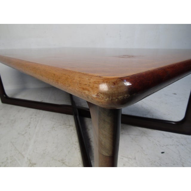 Elegant vintage modern rectangular coffee table with an "X" sled style base. A sleek Danish design with beautiful rosewood...