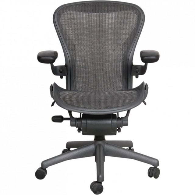 Herman Miller Aaron chair in grey, size b, from around 2012. The chair appears in good condition with a few minor marks...