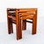 A newly refinished set of three floating top teak nesting tables, made in Denmark c. 1960s. Each table features a...