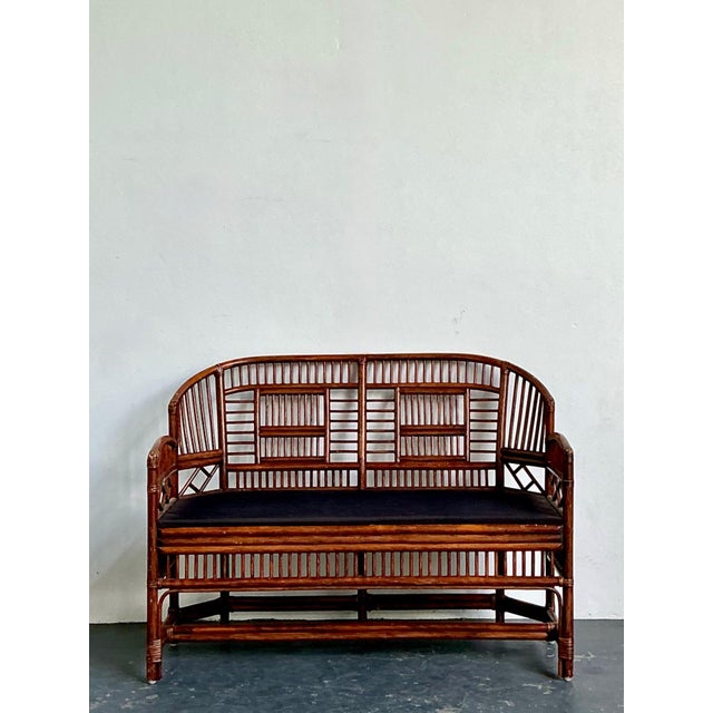 This captivating vintage rattan settee draws inspiration from the exotic architectural romance of the Brighton Pavilion,...