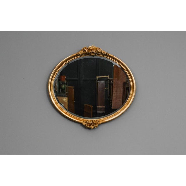 Item: Wall mirror Period & Style: Historicist style - second half of the 20th century Features: - Elegant oval wall mirror...