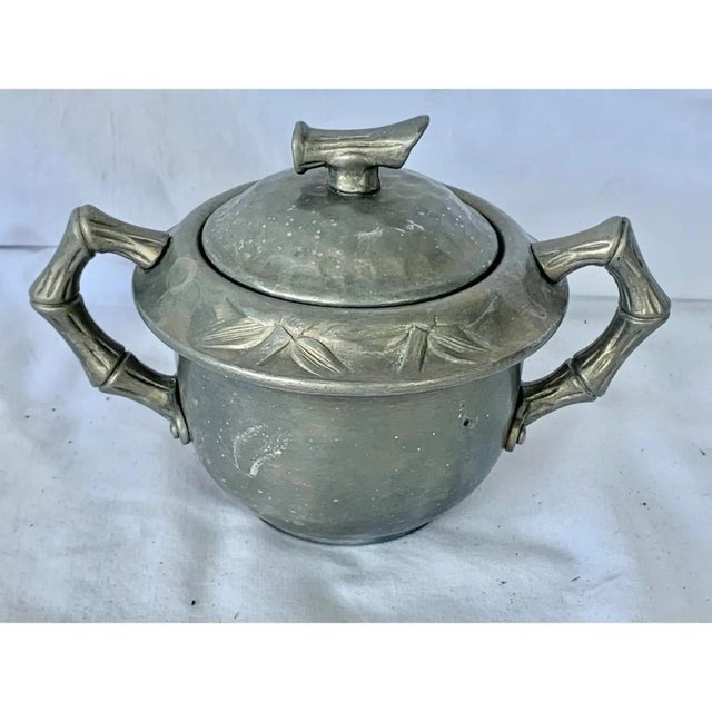 Fun vintage sugar container. Made by Everlast out of aluminum. Faux bamboo details on the handles and top. Perfect to use...