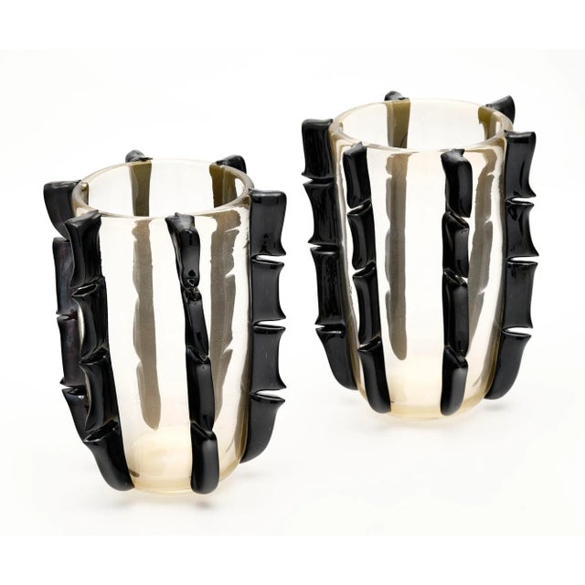 Pair of vases, Italian, from the island of Murano. Each hand-blown piece is made of clear glass with 24 carat gold flecks...