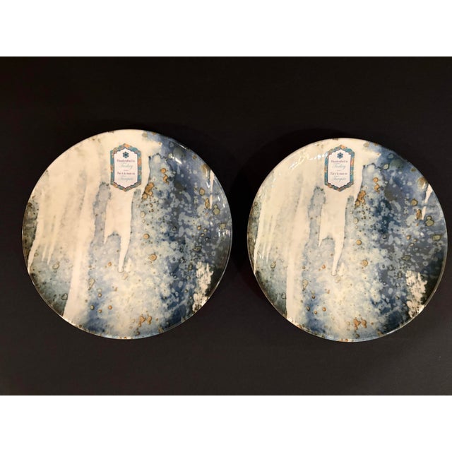 This elegant modern set of salad plates in blue and white feature an organic marble design with gold spots. Made in...