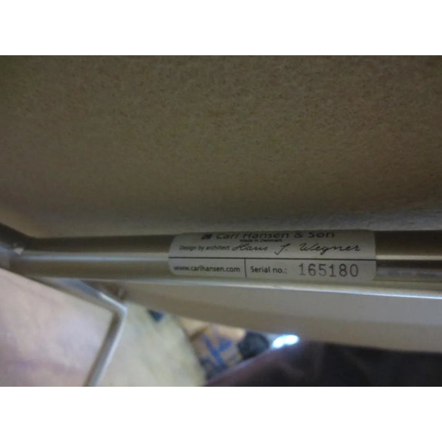 The Carl Hansen &amp; Søn CH445 Wing Lounge Chair, designed by Hans J. Wegner in 1960, is a masterpiece of Danish design...