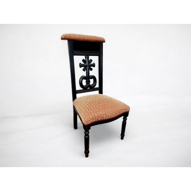 This late 19th-century French prie-dieu prayer chair is a striking example of Gothic Revival ecclesiastical furniture,...