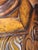 Polished round dining table has a burl wood veneer top with a high-gloss finish. The base is a four-column pedestal with...