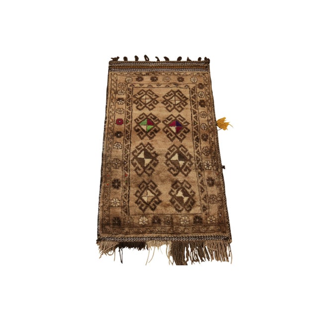 Paying tribute to the nomadic sensibilities of Baluchistan, a xX4 antique Baluch rug coming from Persia circa 1920-1930....