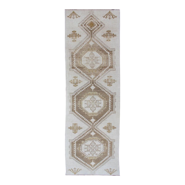 Subdued Vintage Hand Knotted Turkish Oushak Runner With Medallions in Cream and Brown For Sale