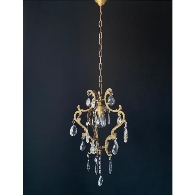 A beautiful antique chandelier in the louis xv style. italy, 20th century. the chandelier is made of brass—beautifully...